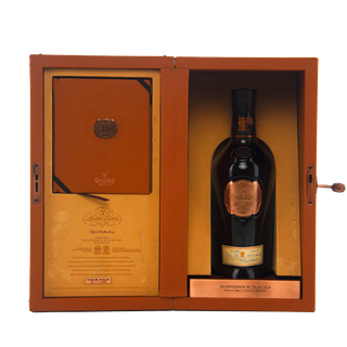 Whiskey bottle in a wooden box with a visible brand label on a white background
