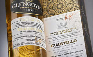 Close-up of the Glengoyne Cuartillo Single Malt Scotch Whisky bottle and packaging, a travel retail exclusive with rich spices, sherried sweetness, and gold, black, and white accents.