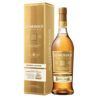 A bottle of Glenmorangie Nectar D’or Sauternes Cask Finish Single Malt Scotch Whisky stands beside its gold box, both labeled with Sauternes Cask Finish and notes of lemon and lime zest from maturation in Sauternes casks.