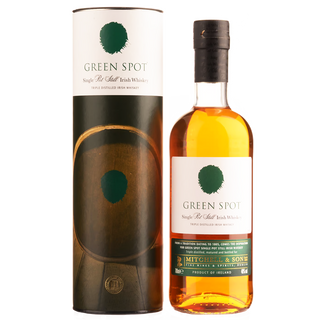 A bottle of Green Spot Single Pot Still Irish Whiskey stands beside its cylindrical packaging, both with a green spot logo and white label accented in green and gold. The amber whiskey features notes of green apples and orchard fruits.