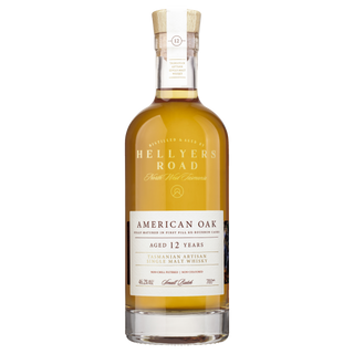 A bottle of Hellyers Road 12 Year Old American Oak Single Malt Tasmanian Whisky with a wooden cork and clear label, featuring caramel and sweet oak notes, displayed on a white background.