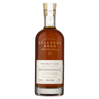 A bottle of Hellyers Road Double Cask Single Malt Tasmanian Whisky with a cork stopper and gold and cream labels stands upright against a white background—inside, discover notes of dried fruits and sweet vanilla.