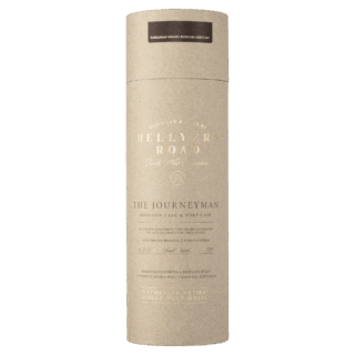 A beige cylindrical cardboard container with white text displaying "Hellyers Road The Journeyman Single Malt Tasmanian Whisky" and product details, used for packaging whisky featuring notes of vanilla and honey.