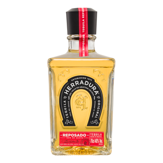 Herradura Reposado Tequila 700ml features a gold-hued liquid, black label with red accents, 100% de Agave, 40% Alc/Vol, and tasting notes of toasted oak and sweet agave. The bottle has a black cap topped with a red seal.
