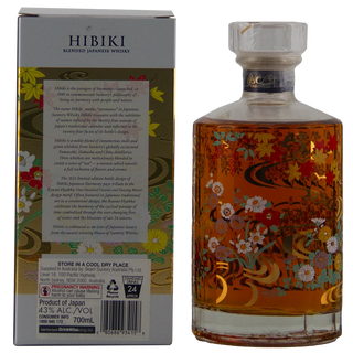 Hibiki Blended Japanese Whisky 700ml bottle with floral and gold patterned glass next to its product box, showing amber liquid inside.