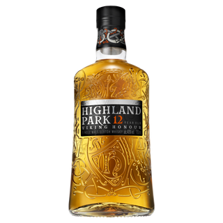 A bottle of Highland Park 12 Year Old Viking Honour Single Malt Scotch Whisky featuring intricate gold embossed designs on clear glass and a black front label.