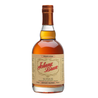 A bottle of Willett Family Estate Johnny Drum Kentucky Bourbon Whiskey with a beige label, red and brown text, and a brown cap, set against a white background—celebrated for its caramel and oak notes.
