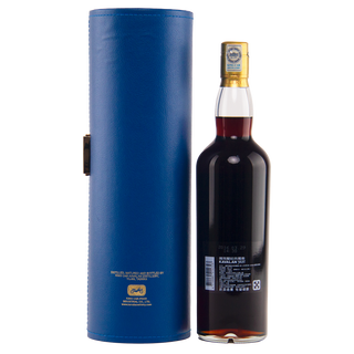 A bottle of Kavalan Solist Vinho Barrique Cask W120120118A Single Malt Whisky, with an Asian-character label, sits next to a blue leather case with gold stitching and crest, promising wine-kissed sweetness and toasted oak notes.