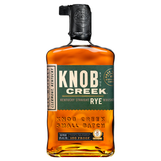 A bottle of Knob Creek Kentucky Straight Rye Whiskey, featuring a black cap and two green labels with brand details, reveals its amber liquid through clear glass. The whiskey offers rich notes of rye spice and toasted oak.