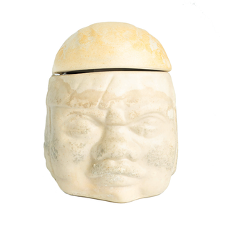La Cofradia Cabeza Olmeca Extra Añejo 500ml comes in a cream-colored ceramic jar shaped like a human head with defined features and a matching lid, blending ancient artistry with the warm, earthy notes of toasted oak.