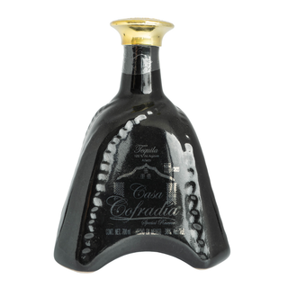 A uniquely shaped black bottle of La Cofradia Casa Cofradia Añejo 700ml tequila with a gold cap and silver accents displays the brand name in elegant script, suggesting hints of sweet agave and subtle toasted oak flavors.