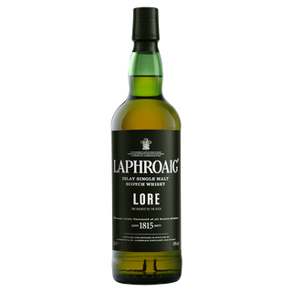 A bottle of Laphroaig Lore Single Malt Scotch Whisky features a black label with "The Richest of the Rich" and "1815," plus a green neck and gold whisky inside, hinting at peat smoke and sherried sweetness.