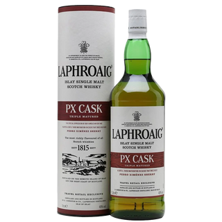 A bottle of Laphroaig PX Cask Single Malt Scotch Whisky stands beside its cylindrical packaging, both featuring white, gold, and maroon labels that evoke rich peat smoke and sherried sweetness.