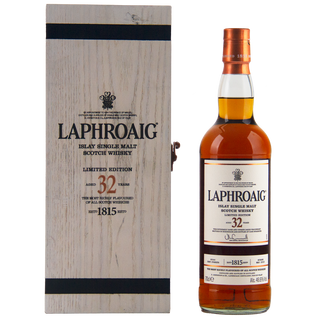 Laphroaig 32-year-old single malt Scotch whisky bottle and wooden box on a white background