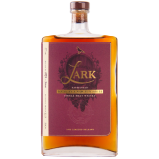 A bottle of Lark Muscat Cask Finish II Single Malt Whisky features a purple label and offers rich, comforting notes reminiscent of buttery raisin toast.