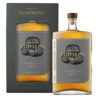 A bottle of Lark Symphony no.1 Tasmanian Whisky stands before its matching gray and gold box, both decorated with whisky barrel illustrations—a tempting nod to honey and dried fruit flavors inside.