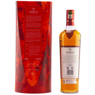 The Macallan A Night on Earth Single Malt Scotch Whisky, featuring a white label and golden liquid, stands beside its tall red patterned box with white text, offering vanilla notes and an elegant look against a plain white background.