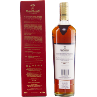 A bottle of The Macallan Classic Cut 2019 Release Single Malt Scotch Whisky stands beside a red box. The label is turned backward to display details, while the box’s gold and white text highlights its oak spice notes and distinctive origins.