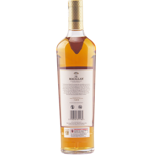 A bottle of The Macallan Classic Cut 2021 Release Single Malt Scotch Whisky is shown from the back, label visible, revealing product details and branding with hints of fresh vanilla notes against a plain white background.