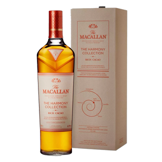 A bottle of The Macallan Harmony Collection Rich Cacao Single Malt Scotch Whisky stands beside its beige box, both showing the brand name and details in red and brown, evoking flavors of honey and rich dark chocolate.
