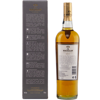 A bottle of The Macallan 10 Year Old Fine Oak Single Malt Scotch Whisky stands beside its grey box, featuring detailed product information and highlighting its fine oak character in gold and white text.