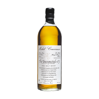 A bottle of Michel Couvreur Unexpected #3 French Single Malt Whisky with a white label displaying its origin, bottling date, and ABV. Its refined character is enhanced by subtle notes of roasted hazelnuts and marzipan.