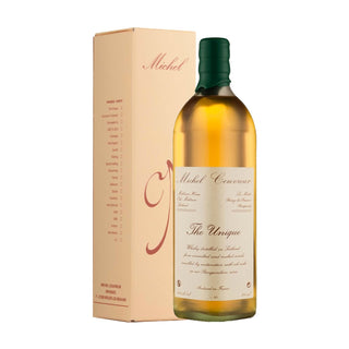 A bottle of Michel Couvreur The Unique French Whisky, with a green cap and cream label, stands before its beige box with red script, offering hints of citrus zest and roasted nuts in its golden spirit.