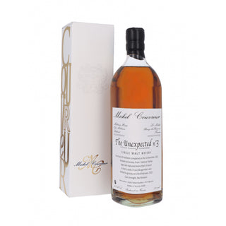 A bottle of Michel Couvreur Unexpected #3 French Single Malt Whisky beside its box, evoking the rich aroma of roasted hazelnuts.