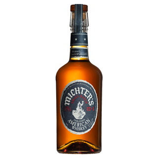 A bottle of Michter’s US*1 American Whiskey features brown liquid in dark glass with a black and silver label, sealed by a black wax-topped cork, offering vanilla caramel notes and a smooth finish.