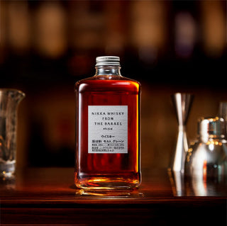 A bottle of Nikka From the Barrel Blended Japanese Whisky sits on the bar, its aroma offering hints of vanilla and dark chocolate.
