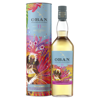 A bottle of Oban 11 Year Old Single Malt Scotch Whisky stands beside its vibrant tropical-themed packaging, boasting colorful artwork and offering hints of citrus zest and smooth malt in every sip.