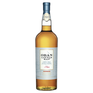 A bottle of Oban Little Bay Single Malt Scotch Whisky with a blue cap and white label featuring black and red text, set against a plain white background; recognized for its ripe fruit and oak spice notes.