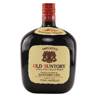 Old Suntory whisky bottle with a red cap on a white background