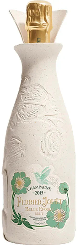 White champagne bottle with gold top and floral label on a white background