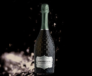 Bottle of Prosecco with a dark background
