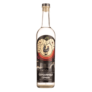 A clear glass 700ml bottle of QuiQuiRiQui Espadin Mezcal features a vibrant label with a rooster illustration and bold text. The mezcal offers sweet agave and gentle smoke notes, displayed against a plain white background.