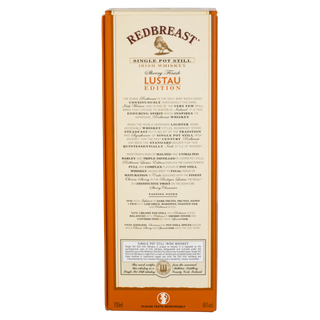 The back of a Redbreast Lustau Edition Single Pot Still Irish Whiskey box shows product details, tasting notes of sherry and spiced sweetness, and gold, black, and red branding on a cream background with an orange border.