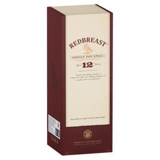 A box of Redbreast 12 Year Old Single Pot Still Irish Whiskey hints at the sherry sweetness and dried fruit flavors that define this renowned Irish spirit.