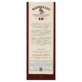 Rectangular label for Redbreast 12 Year Old Single Pot Still Irish Whiskey, with red and gold text, whiskey description, tasting notes of spicy fruitcake and dried fruits, plus a seal at the bottom.