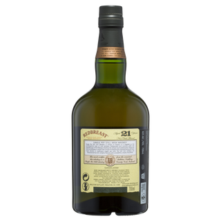 A bottle of Redbreast 21 Year Old Single Pot Still Irish Whiskey with a green glass body, black cap, and detailed label is shown against a plain white background, highlighting its renowned dried fruit notes.