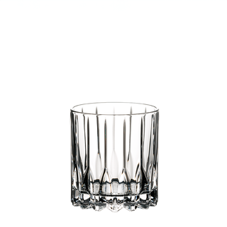 Clear glass tumbler with textured base on a white background