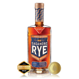 A bottle of Sagamore Spirit Double Oak American Rye Whiskey with creamy toffee notes, shown alongside its gold medals from the 2024 Bartender Spirits Awards and the San Francisco World Spirits Competition.