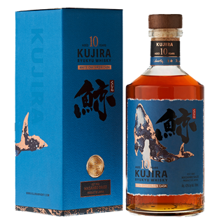 A bottle of Kujira Ryukyu 10 Year Old Japanese Whisky comes in a blue box with Japanese calligraphy, a whale illustration, and gold accents. This whisky is spiced, rich amber in color, and aged for 10 years in white oak sherry casks.
