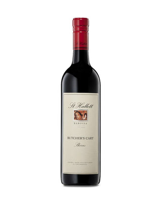 A bottle of St Hallett Barossa 'Butcher's Cart' Shiraz red wine, featuring a dark glass bottle with a cream-colored label and a red foil seal on the neck, set against a plain white background.