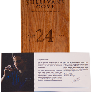 Wooden box with 'Sullivans Cove' branding and a letter about the whisky, featuring a person drinking whisky.
