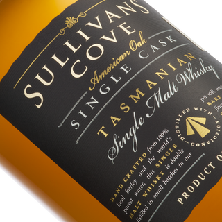Close-up of a black and gold label on a bottle of Sullivans Cove 15 Year Old American Oak ex-Bourbon TD0327 Single Malt Whisky, showcasing intricate text and design with subtle vanilla notes.