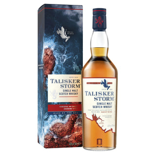 A bottle of Talisker Storm Single Malt Scotch Whisky stands beside its box, decorated with stormy waves and a rugged coast—an ideal match for this smoky, coastal whisky, highlighted by a label with map details and blue, red, and gold accents.