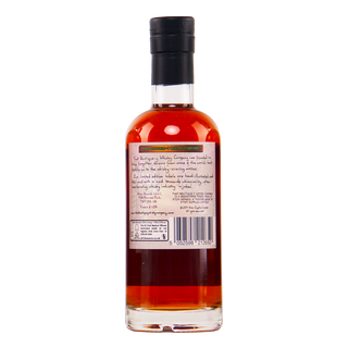 Bottle of alcohol with a label on a white background