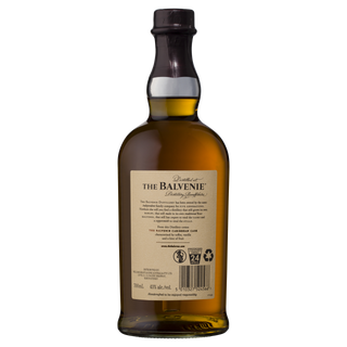 A bottle of The Balvenie Caribbean Cask 14 Year Old Single Malt Scotch Whisky with a tan label and back barcode is set against a white background, its elegant look hinting at subtle notes of vanilla and toffee.