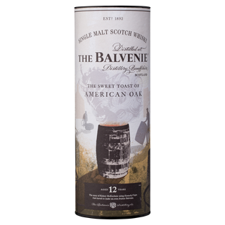 A cylindrical container of The Balvenie Stories The Sweet Toast of American Oak 12 Year Old Single Malt Scotch Whisky, with branding, a barrel image, and text highlighting vanilla and oak spice notes.